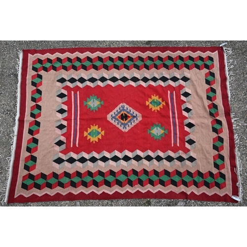 838 - An old Turkish Kelim, the red ground with geometric designs, 277 cm x 196 cm