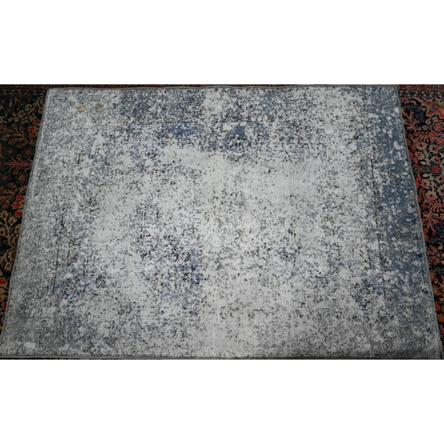 845 - A contemporary Persian vintage loaded rug, having the appearance of a worn fragment, 181 cm x 133 cm