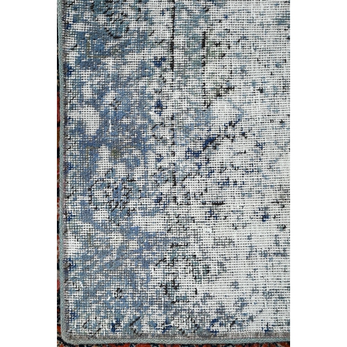 845 - A contemporary Persian vintage loaded rug, having the appearance of a worn fragment, 181 cm x 133 cm