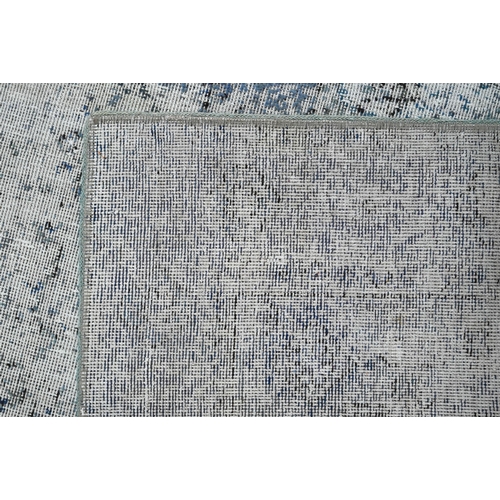845 - A contemporary Persian vintage loaded rug, having the appearance of a worn fragment, 181 cm x 133 cm