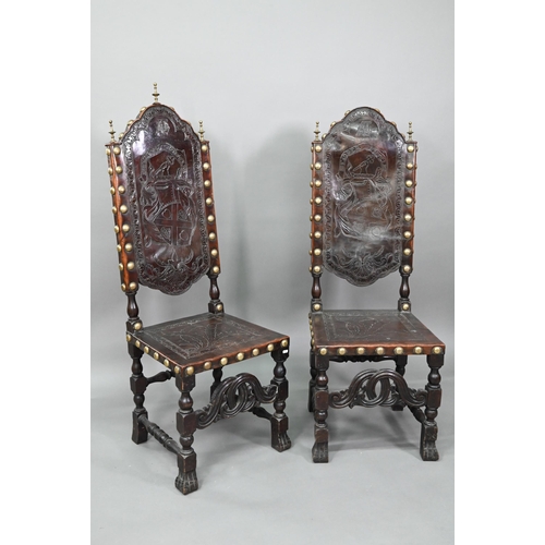 852 - A pair of late 19th century walnut framed hall chairs, the studded brass leather seat and back in to... 