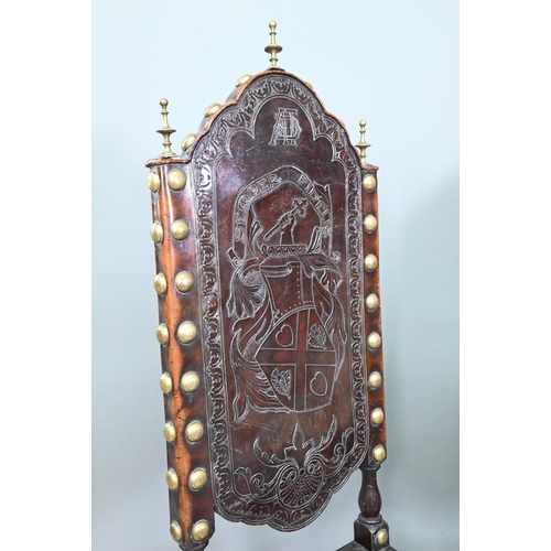 852 - A pair of late 19th century walnut framed hall chairs, the studded brass leather seat and back in to... 