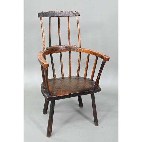 857 - An 18th century oak/elm low spindle back Windsor armchair, West Country, raised on stick legs