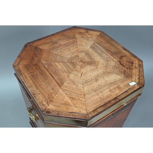 874 - A George III brass bound mahogany wine cooler of octagonal form, with internal zinc liner, raised on... 