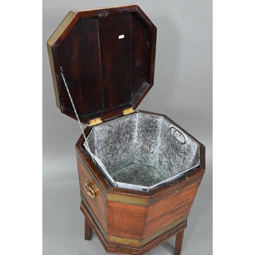 874 - A George III brass bound mahogany wine cooler of octagonal form, with internal zinc liner, raised on... 