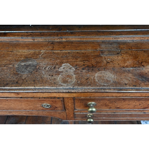 875 - An 18th century oak high dresser, the open back three tier rack with iron hooks, over an arrangement... 