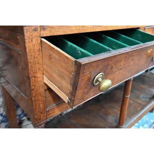 875 - An 18th century oak high dresser, the open back three tier rack with iron hooks, over an arrangement... 