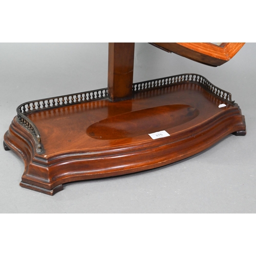 876 - A large Victorian Sheraton Revival mahogany framed adjustable shield shaped toilet mirror, with beve... 