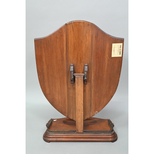 876 - A large Victorian Sheraton Revival mahogany framed adjustable shield shaped toilet mirror, with beve... 