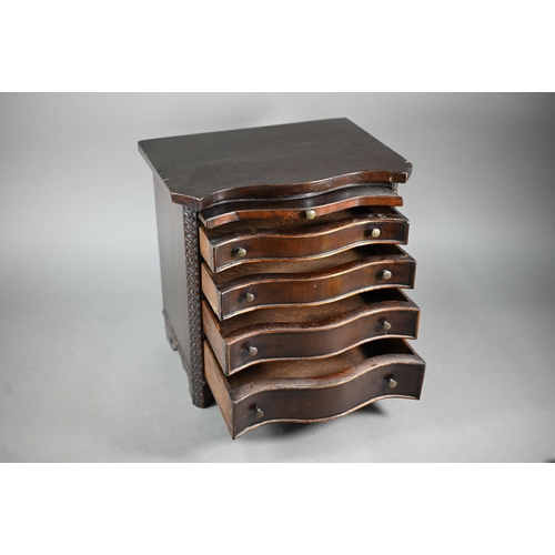 877 - An miniature mahogany serpentine chest of four long graduated drawers, in the Chippendale style with... 