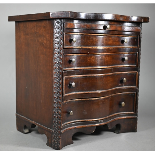 877 - An miniature mahogany serpentine chest of four long graduated drawers, in the Chippendale style with... 