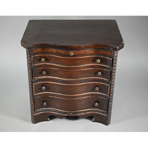 877 - An miniature mahogany serpentine chest of four long graduated drawers, in the Chippendale style with... 