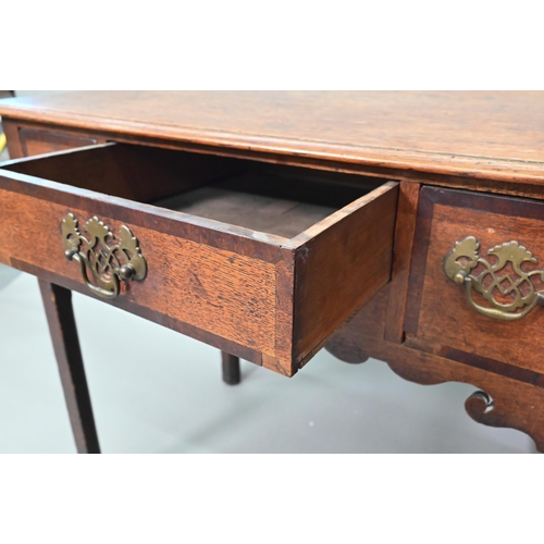 878 - A Georgian country oak three drawer lowboy, raised on inner chamfered square legs, later brass fitti... 