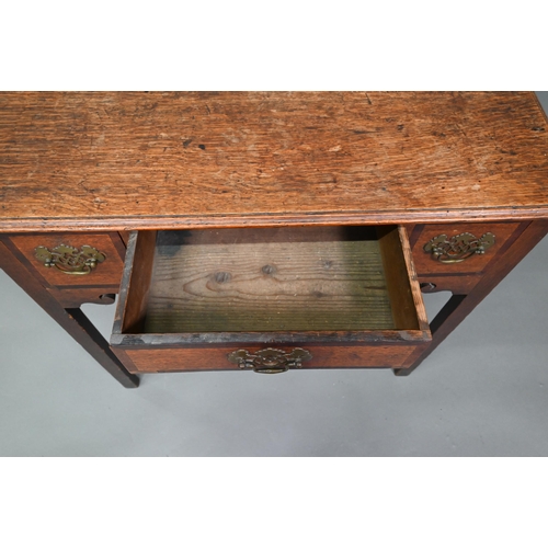 878 - A Georgian country oak three drawer lowboy, raised on inner chamfered square legs, later brass fitti... 