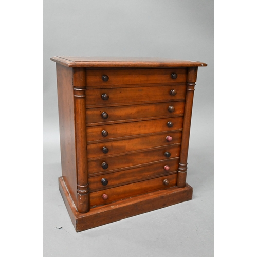 879 - A Victorian miniature Wellington collectors chest of eight drawers, on a plinth base, 48 cm w x 30 c... 