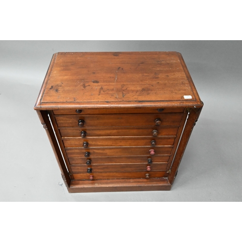 879 - A Victorian miniature Wellington collectors chest of eight drawers, on a plinth base, 48 cm w x 30 c... 