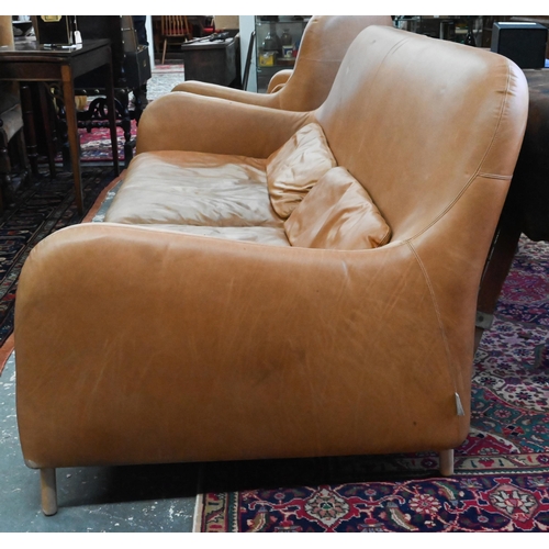 883 - AMMENDMENT - Habitat - tan leather sofa and matching armchair designed by Aaron Probyn, raised on sh... 