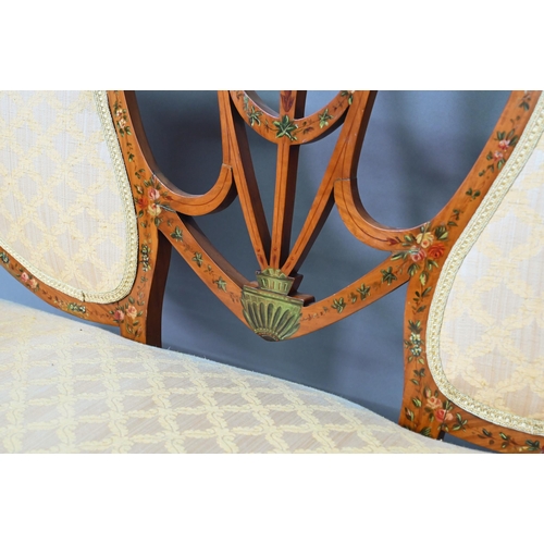 886 - An Edwardian Sheraton Revival polychrome decorated satinwood sofa, with fabric back panels over an c... 