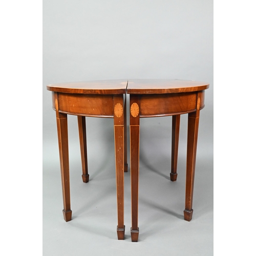 888 - A pair of boxwood inlaid figured mahogany Sheraton Revival demi-lune tables, raised on square taperi... 