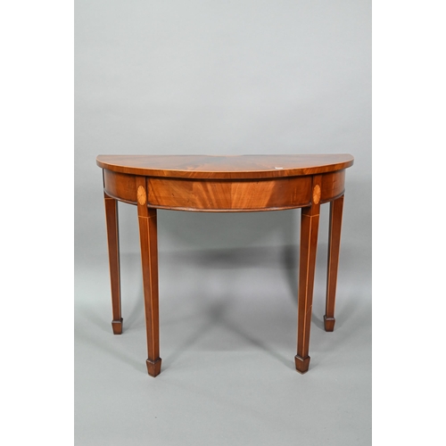 888 - A pair of boxwood inlaid figured mahogany Sheraton Revival demi-lune tables, raised on square taperi... 