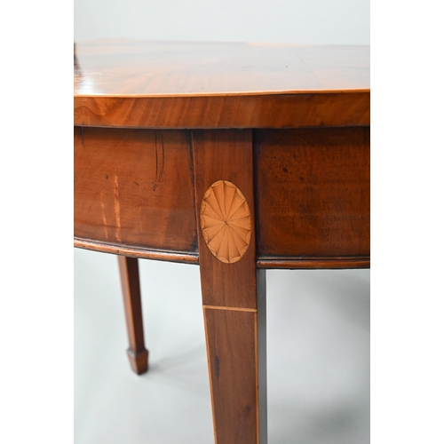 888 - A pair of boxwood inlaid figured mahogany Sheraton Revival demi-lune tables, raised on square taperi... 