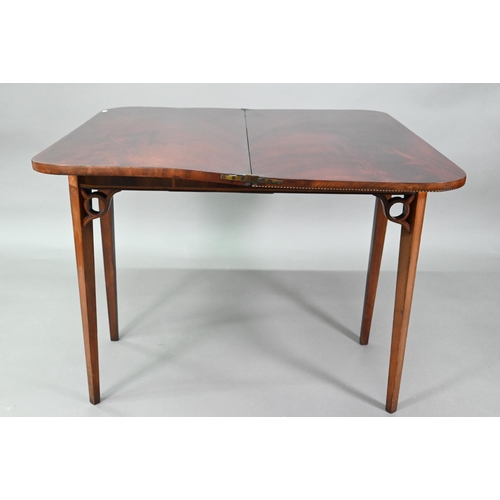 889 - A Victorian figured mahogany inlaid tea table, the fold over top raised on canted square tapering le... 