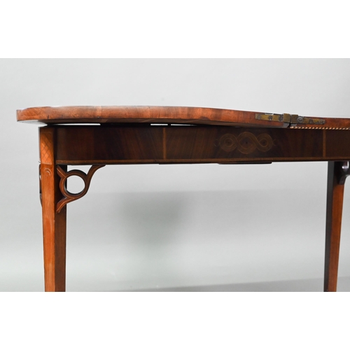 889 - A Victorian figured mahogany inlaid tea table, the fold over top raised on canted square tapering le... 