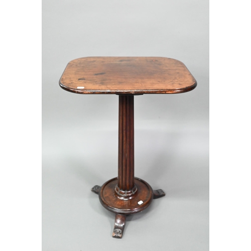 894 - A George III mahogany occasional table, the rectangular top raised on a fluted column to a circular ... 