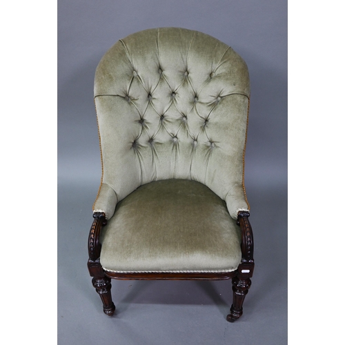 901 - A Victorian deep-buttoned green dralon nursing chair, raised on moulded turned front legs