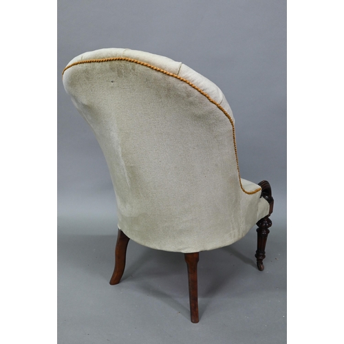 901 - A Victorian deep-buttoned green dralon nursing chair, raised on moulded turned front legs