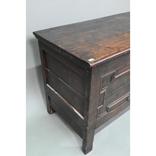 902 - A late 17th century oak coffer, with applied geometric moulded front panels, raised on stiles - prev... 