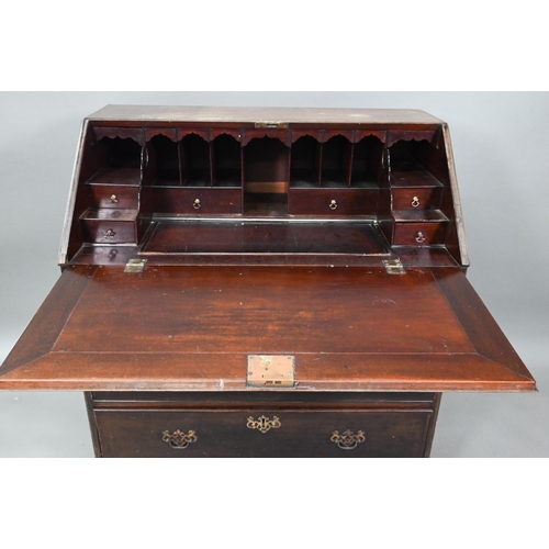 906 - A George III mahogany bureau, the fitted interior with slide top well over a dummy drawer, two short... 