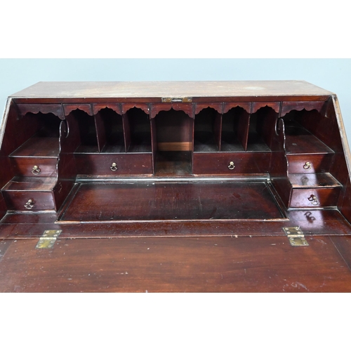 906 - A George III mahogany bureau, the fitted interior with slide top well over a dummy drawer, two short... 