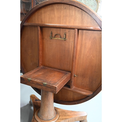 909 - An early Victorian rosewood breakfast table, the circular tilt top raised on a turned support, to a ... 