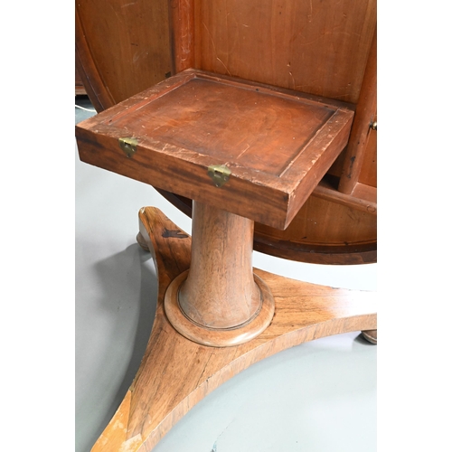 909 - An early Victorian rosewood breakfast table, the circular tilt top raised on a turned support, to a ... 