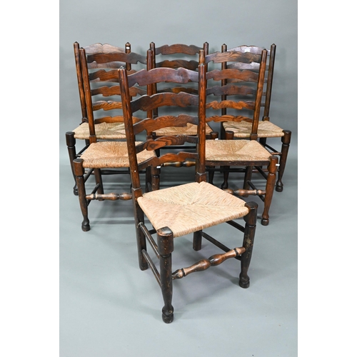 910 - A set of six Lancashire oak framed rope seat chairs, with wavy ladder backs (6)