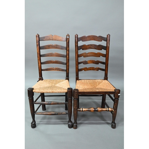 910 - A set of six Lancashire oak framed rope seat chairs, with wavy ladder backs (6)