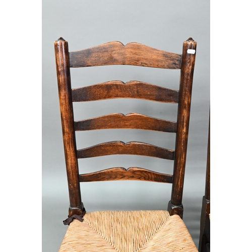 910 - A set of six Lancashire oak framed rope seat chairs, with wavy ladder backs (6)