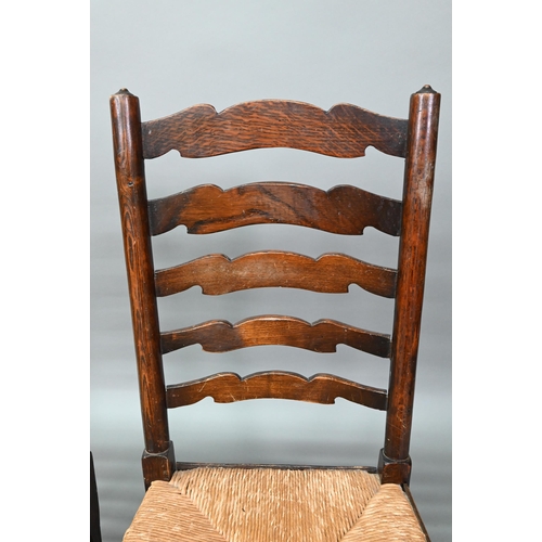 910 - A set of six Lancashire oak framed rope seat chairs, with wavy ladder backs (6)