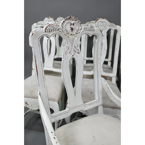 917 - A set of seven French dining chairs in distress painted finish, with fabric seats comprising six sid... 