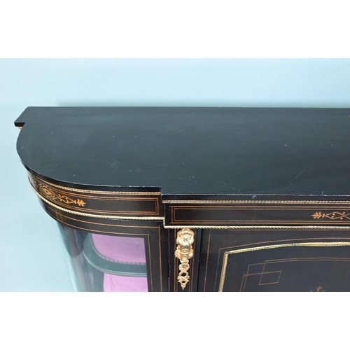 918 - A Victorian gilt metal mounted ebonised credenza, the gilt stencilled centre cabinet door flanked by... 