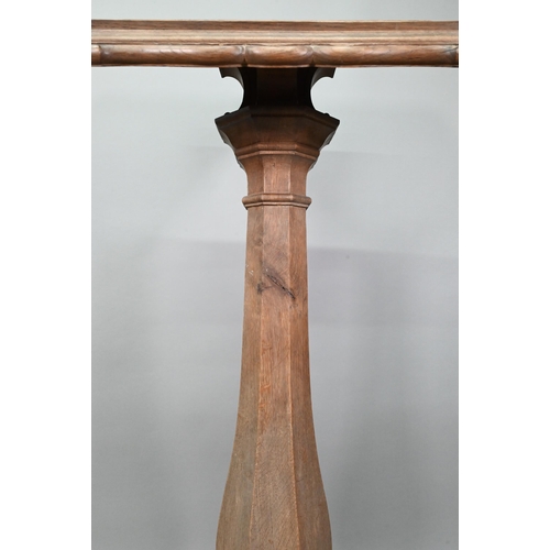 921 - A weathered antique oak lectern, the sloped shaped top raised on octagonal baluster column and stepp... 