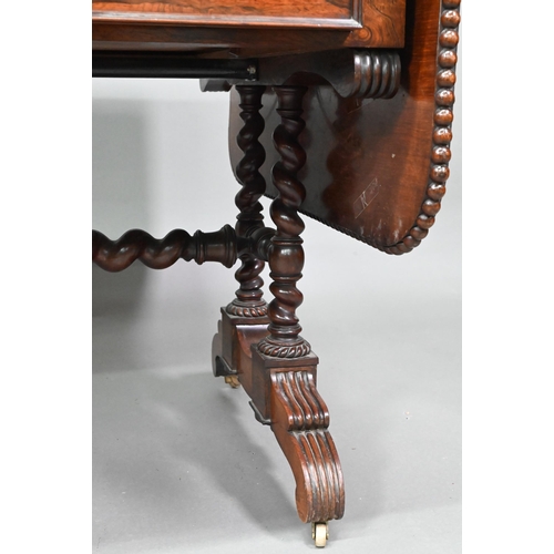 922 - A Regency rosewood sofa/library table, the rectangular top with beaded edge and rounded drop leaf en... 