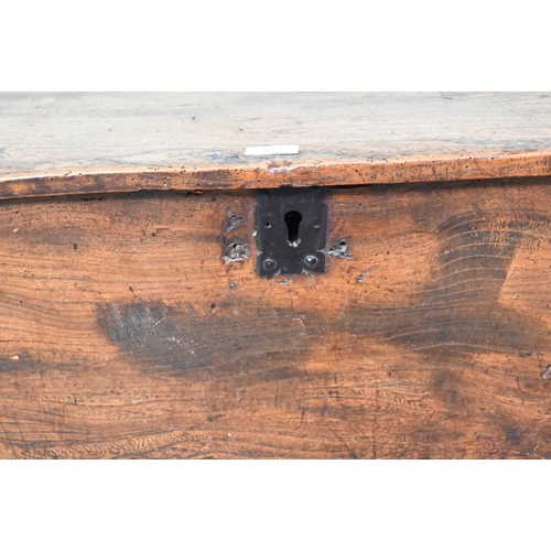 923 - A 17th century elm six-plank coffer, raised on 'V' cut ends, 120 cm w x 40 cm x 56 cm h