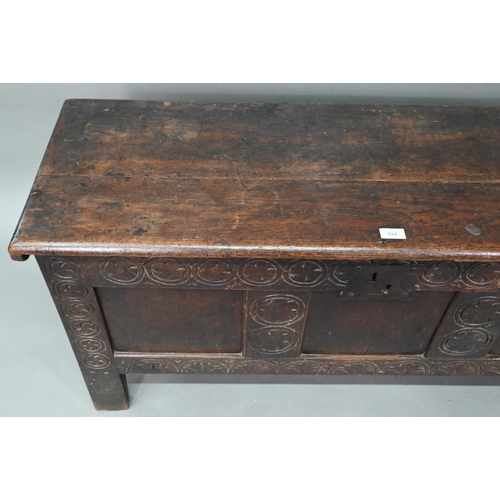 924 - A 17th century oak coffer with triple panelled front and craved stiles, 120 cm w x 40 cm x 56 cm h