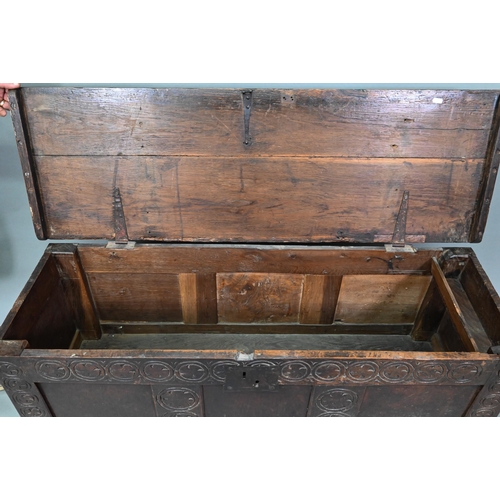 924 - A 17th century oak coffer with triple panelled front and craved stiles, 120 cm w x 40 cm x 56 cm h