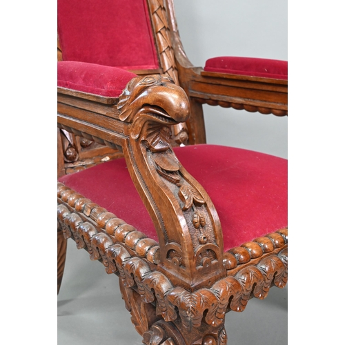 928 - A carved and moulded oak framed 'throne' chair, with crimson fabric panelled back and seat, the vers... 