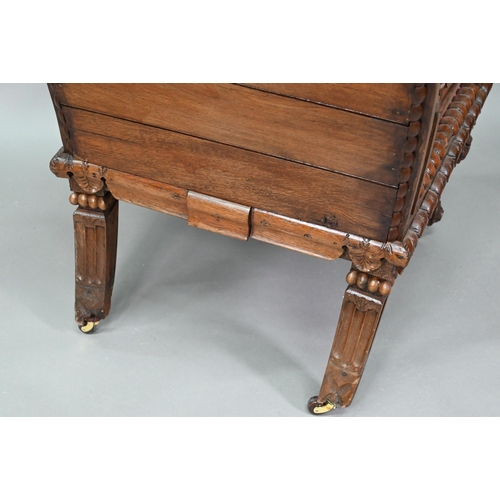 928 - A carved and moulded oak framed 'throne' chair, with crimson fabric panelled back and seat, the vers... 