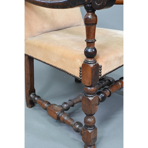 932 - An 18th century walnut open framed and upholstered high back armchair, on a part turned H stretcher ... 