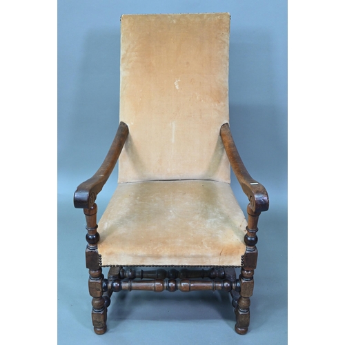 932 - An 18th century walnut open framed and upholstered high back armchair, on a part turned H stretcher ... 